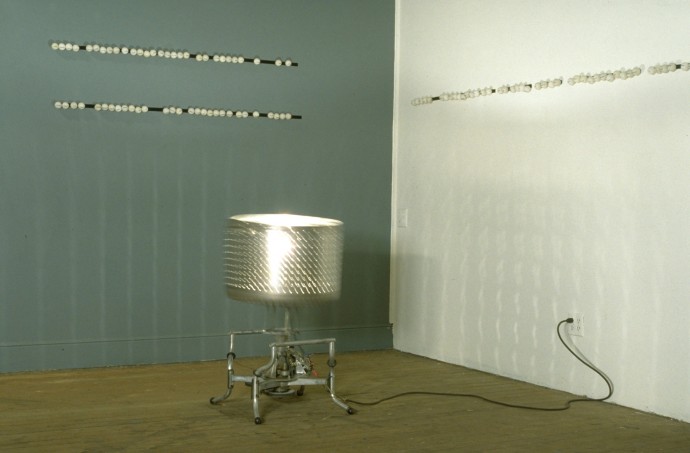 Limited Domain Meaning Machine by Ken Rinaldo and Amy Youngs Premiere at ACME Gallery San Francisco 1995. Washing machine tub, motor, light, electronics, velcro and ping-pong balls with dry transfer lettering.